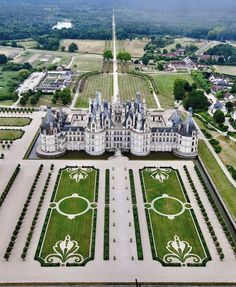 an aerial view of a large white castle