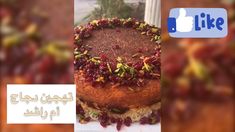 the cake is decorated with nuts and cranberries on it's own side