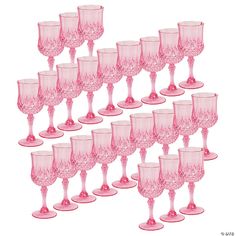 a set of twelve pink goblets sitting next to each other on a white background