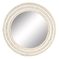 a round mirror with rope around it