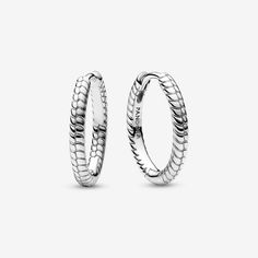 Create an instantly iconic look with the Pandora Moments Small Charm Hoop Earrings. These sterling silver earrings feature Pandora's famous snake chain pattern. These hoop earrings have a diameter of 18 mm, compared to the existing 25 mm style, and can hold one charm or dangle charm. Sleek on their own or personalized when paired with your favorite charms, these hoops are a style win. Please note that due to the smaller size and thickness of the hoops, some charms may not fit on these earrings. - Pandora Moments Small Charm Hoop Earrings - Sterling silver Earrings Pandora, Pandora Earrings, Charms Pandora, Chain Pattern, Mesh Bracelet, Small Charms, Dangle Charms, Snake Chain, Chain Bracelet