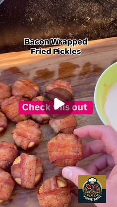 bacon wrapped fried pickles on a cutting board next to a bowl of yogurt