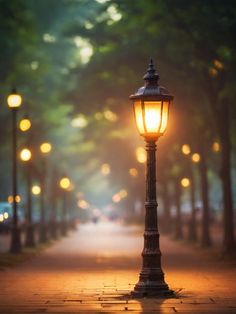 a street light on the side of a road with trees and lights in the background