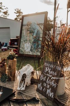 a table topped with pictures and plants on top of it