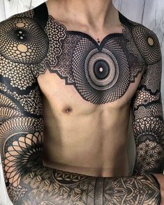 a man with tattoos on his chest and arm is wearing an intricately designed shirt