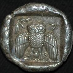 an old metal stamp with an owl on it