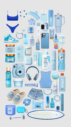 an assortment of blue items arranged in the shape of a heart on a white background