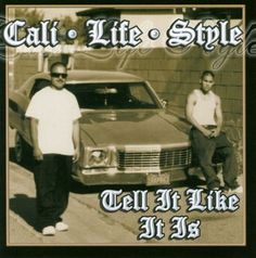 two men standing in front of a car with the words call life style on it