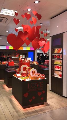 a display in a store filled with lots of red hearts