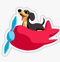 a dog riding on top of a red airplane with a propeller in the shape of a plane