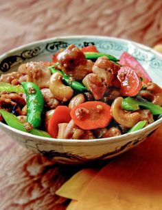 a close up of a bowl of food on a table