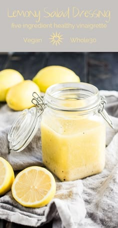 lemon salad dressing in a mason jar with sliced lemons around it and text overlay that reads, lemon salad dressing have ingredient healthy ingredients vegan whole