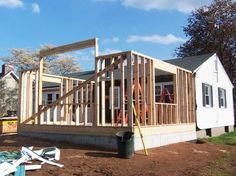 a house being built with wooden framing