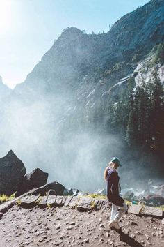 a person standing on the side of a mountain