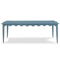 a blue bench with scalloped legs and a long table on the bottom is shown