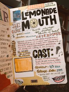 a hand holding up a book with writing on it and an image of lemonade mouth