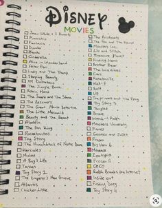 the disney movies list is shown on a notebook