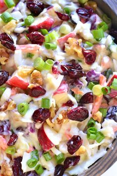 a salad with grapes, celery and nuts in a bowl