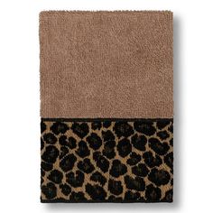 a leopard print towel on top of a tan and black towel holder with two different colors