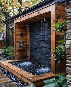 an outdoor shower with water coming out of it