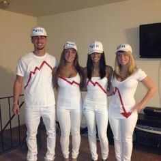 four people dressed up in costumes standing next to each other