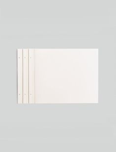 an open white book on a gray background