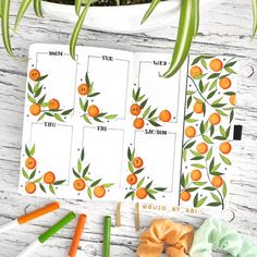 an orange themed planner spread out on a table