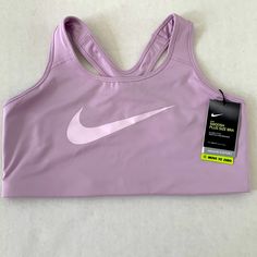 Nike Dri-Fit Swoosh 1x Plus Size Lavender/Light Purple Sports Bra Purple Activewear For Light Sports, Purple Activewear For Casual Sports, Breathable Purple Tops For Sports, Purple Casual Activewear For Light Sports, Sporty Fitted Lavender Activewear, Casual Lavender Activewear For Sports, Breathable Purple Sportswear Top, Purple Breathable Sportswear Tops, Functional Purple Sports Top