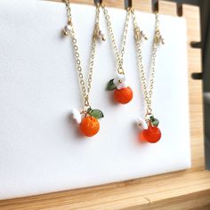 Our cute glass orange bracelets are a perfect match with our orange earrings and necklace. The bracelets are made with Czech glass orange, glass flower, acrylic leaf, handmade pearls and 14k gold plated chains which are good for delicate skin. We have silver version available as well, please contact seller for details. Size: the length is about 7" with 1.25" extender Orange Gifts, Fruit Bracelet, Oranges Gift, Summer Orange, Orange Jewelry, Flower Acrylic, Orange Bracelet, Birthday Bracelet, Orange Earrings