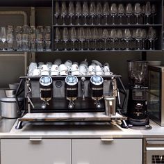 an espresso machine sitting on top of a counter