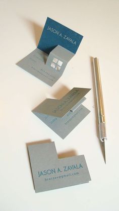 an image of some business cards and a pen on top of the page with google logo