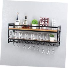 a metal shelf with wine glasses and bottles on it next to a wall mounted bar