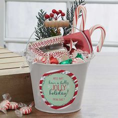 a bucket filled with candy canes and candies