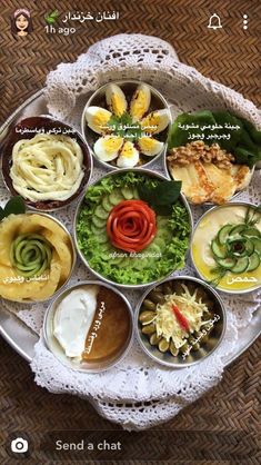 a plate filled with different types of food on top of a doily covered table