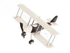 a model airplane flying in the air on a white background