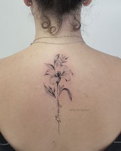 a woman with a tattoo on her back