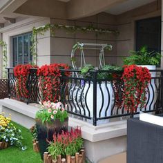 the balcony is decorated with flowers and plants