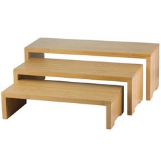 three wooden tables sitting on top of each other