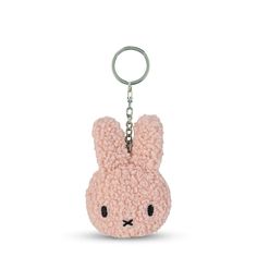 a keychain with a small pink bunny face on it's front end