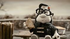 a stuffed animal sitting on top of a wooden bench