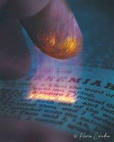 a close up of a person's foot on top of an open book with the word heaven above it