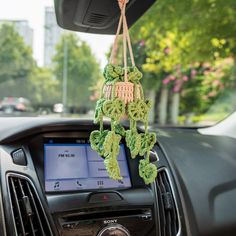 a car dashboard with an air freshener hanging from it's dash board,