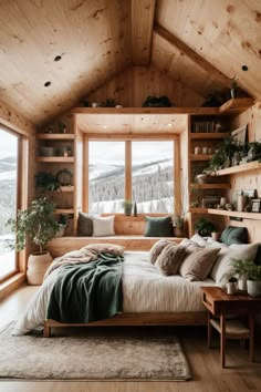 a bedroom with wooden walls and flooring has a large bed in the corner, surrounded by shelves filled with plants