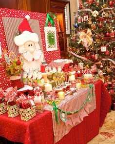 a christmas tree is decorated with presents and decorations