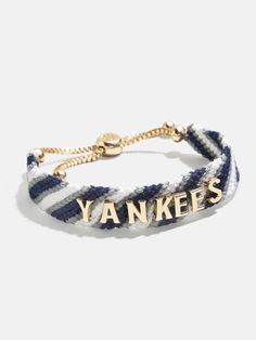 Proudly show off your team loyalty with the New York Yankees MLB Woven Friendship bracelet. This bracelet is crafted with colorful woven thread, which creates a vibrant backdrop for your favorite game day rallying cheer. Secured with an easy pull-tie closure, this spirited and nostalgic accessory will be loved by fellow fans all season long. Please note: due to their handmade nature, each bracelet will be slightly unique. This is an officially licensed MLB product. Yankees Game, Mlb Yankees, Friendship Bracelets Designs, Rallying, Ny Yankees, New York Yankees, Friendship Bracelet, Cute Jewelry, Bracelet Designs