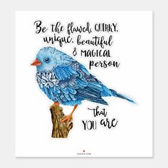 a blue bird sitting on top of a piece of paper with words written below it