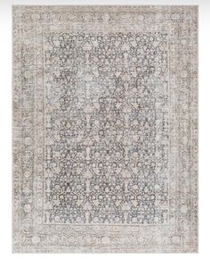 an antique rug with grey and white colors