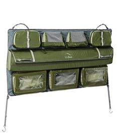 a green and gray hanging organizer with four bags on it's sides, one in the middle