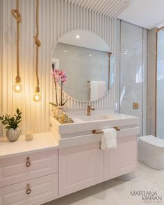 a bathroom with a sink, mirror and toilet