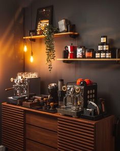 a coffee machine sitting on top of a wooden dresser